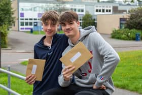 Buddies Josh Lumsden (16) and Bailey Rand (16) with the GCSE results at Havant Academy. Picture: Mike Cooter (240823)