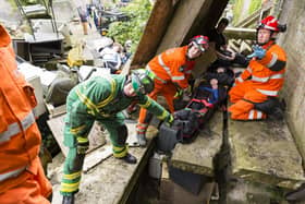 Emergency workers practising in last year's SIMEX simulation.