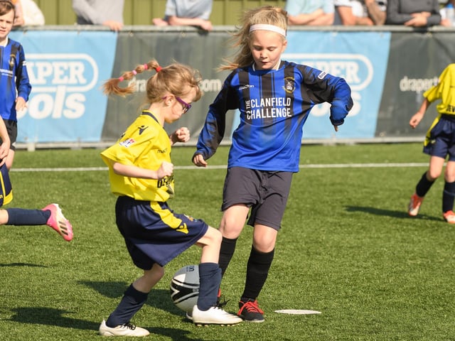 Gosport Borough (yellow/blue kit) lock horns with Clanfield. Picture: Keith Woodland (030621-27)