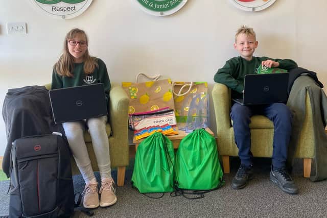 Leesland CE Federation had 10 laptops donated thanks to Gosport Asda, along with £2,000 in grants from the Asda Foundation. Pictured: Leesland pupils Jack and Annabelle with some of the donated kit