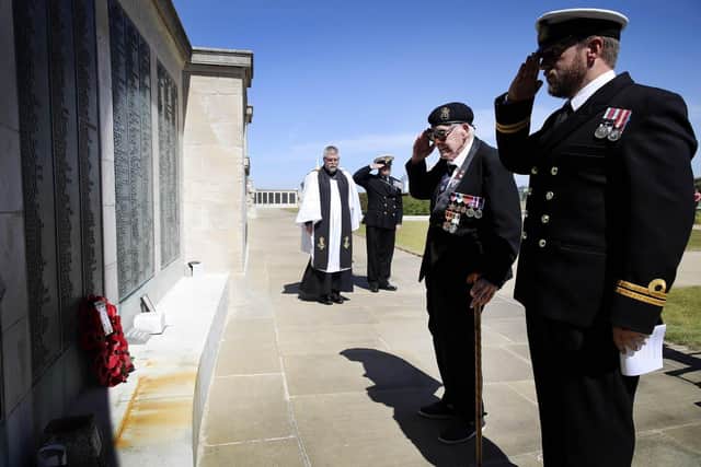 Lawrence Churcher (center) pictured alongside Lieutenant Calvin Shenton (right)