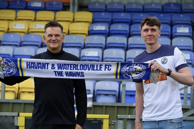 Hawks boss Paul Doswell, left, with new signing Paul Rooney. Picture: Kieron Louloudis