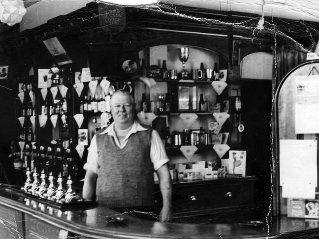 Ernest Diment behind the bar of The Nelson Tavern, Unicorn Road, Portsmouth