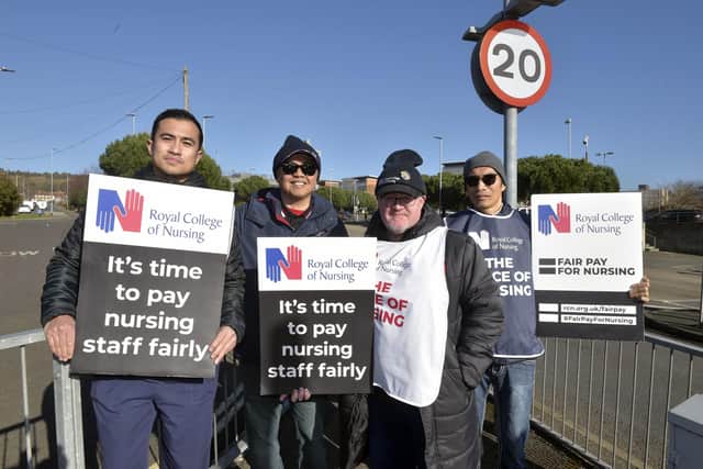Nurses on strike at the picket line oustide QA hospital on February 6, 2023.
(l-r) Louie Nuesa, Eric Babaran, Jamie Barnes and Francisco Guzman.