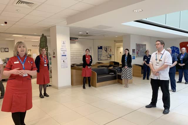 QA staff observing a one minute silence for workers who have died with Covid-19.Picture: Queen Alexandra Hospital  