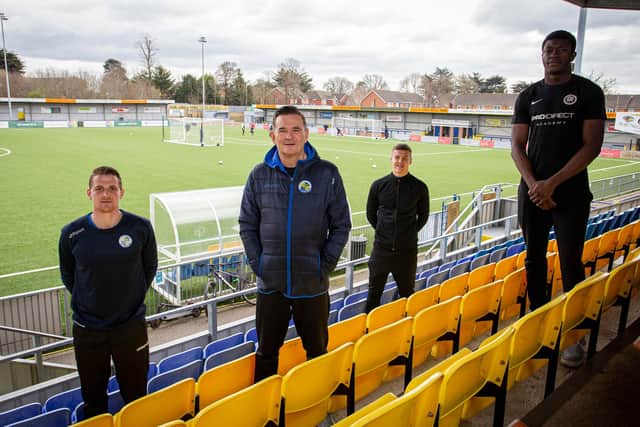 Havant & Waterlooville Pro:Direct Academy head of coaching Joe Oastler, far left, Hawks boss Paul Doswell, second left, and academy players and students Lawson Bright, back centre, and Joel Ngimbi