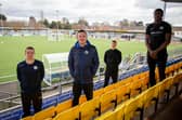Havant & Waterlooville Pro:Direct Academy head of coaching Joe Oastler, far left, Hawks boss Paul Doswell, second left, and academy players and students Lawson Bright, back centre, and Joel Ngimbi