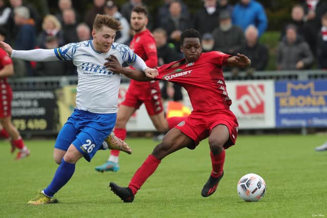 Charlie Ruff pulls back Rebels' Mo Dabre. Picture by Dave Haines