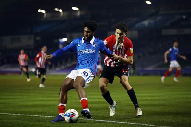 Ellis Harrison attempts to hold off Luke O'Nien during Sunderland's visit. Picture: Bryn Lennon/Getty Images