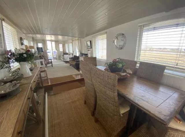 There is an open plan dining area leading to the lounge.