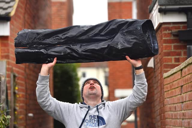 Marcin Jedrysiak from Portsmouth with a pair of his trousers which froze solid in his garden last night, as temperatures across the UK plummeted to their lowest point in two decades. Picture: Roger Arbon/Solent News & Photo Agency