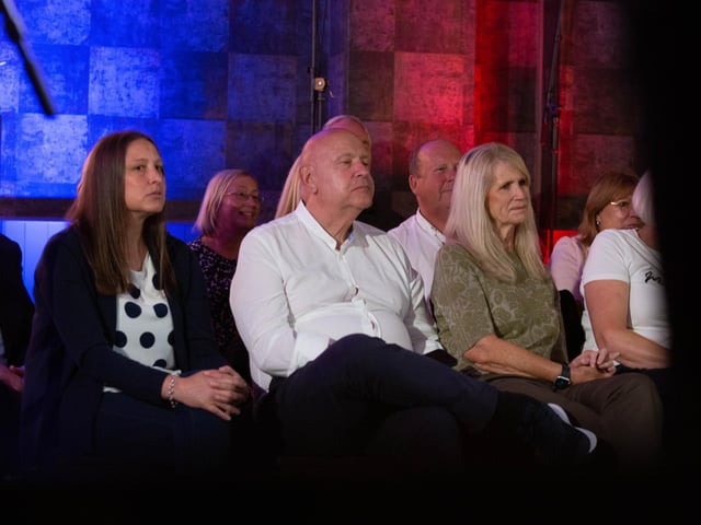 The audience listening to the show.