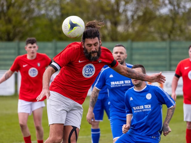 Action from Gosport Town's 4-0 victory over Lee Rangers (blue kit) in the Portsmouth & District FA Trophy final at Cams Alders. Picture: Alex Shute