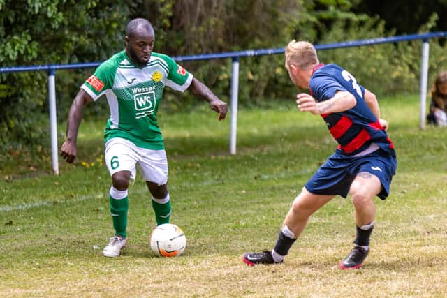 Trialist Enrique Belope, left, on the ball for Moneyfields at Paulsgrove. Picture: Mike Cooter