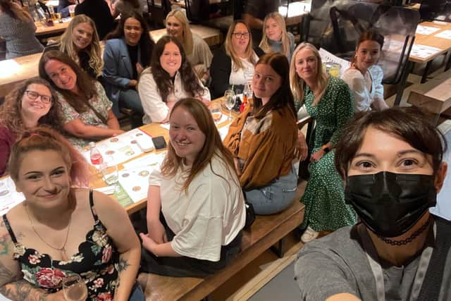 The Rainbow Corner Nursery staff members at Wagamama. Owner Lucy Whitehead is in the green dress.