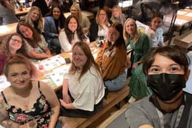 The Rainbow Corner Nursery staff members at Wagamama. Owner Lucy Whitehead is in the green dress. 