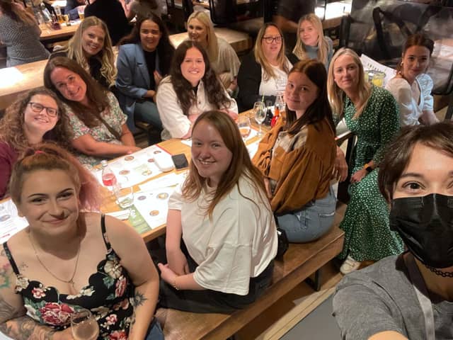 The Rainbow Corner Nursery staff members at Wagamama. Owner Lucy Whitehead is in the green dress. 