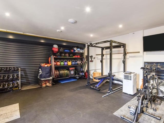 The listing says: "There is a study, utility room and a guest bedroom with en-suite completing the accommodation. Upstairs there are four bedrooms in total, two of which benefit from en-suites. Due to a Grundfos system all showers are high pressure. Air Conditioning is also on offer in the property. The double garage is currently being used as a gym."