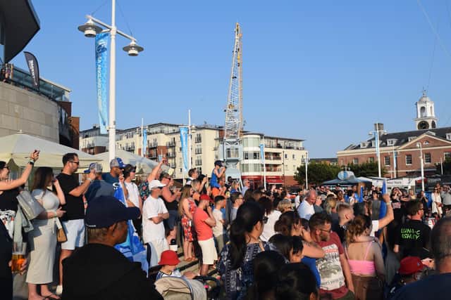 Crowds bask in the Gunwharf Quays sunshine
