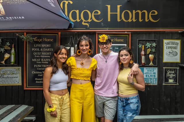 Classmates of Elin Martin wearing the theme colour yellow and sunflowers - the favourite flower of Elin Martin. Pictured: Amie Westphal, 17, Fiona Serle, 18, Cam Nieddu, 17, and April Leckey, 18 Picture: Mike Cooter (070522)