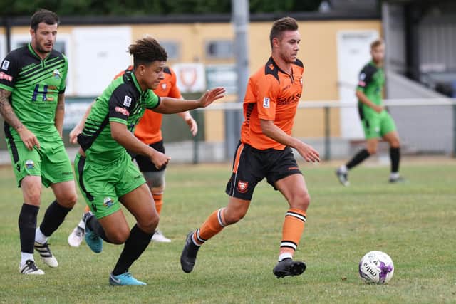 Jack Breed, right, on the ball for AFC Portchester against Gosport Borough in a pre-season friendly in July 2018. Picture: Neil Marshall