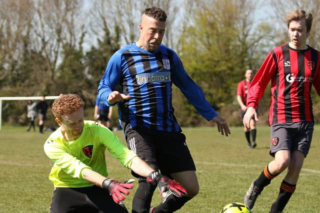 Stand-in Rowner keeper Alex Hall gives away a penalty during the win against Segensworth. Brad Ferrand is on the right. Pic: Kevin Shipp.