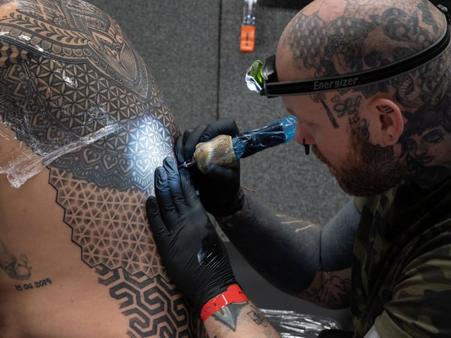 Pictured is: Jen Bradley Tattoos Wayne Huggitt with an intricate pattern
Picture: Keith Woodland (010421-39)