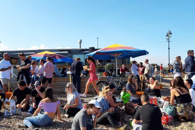 Large crowds gathered on the beach near Southsea Beach Cafe in Eastney Esplanade, Portsmouth.