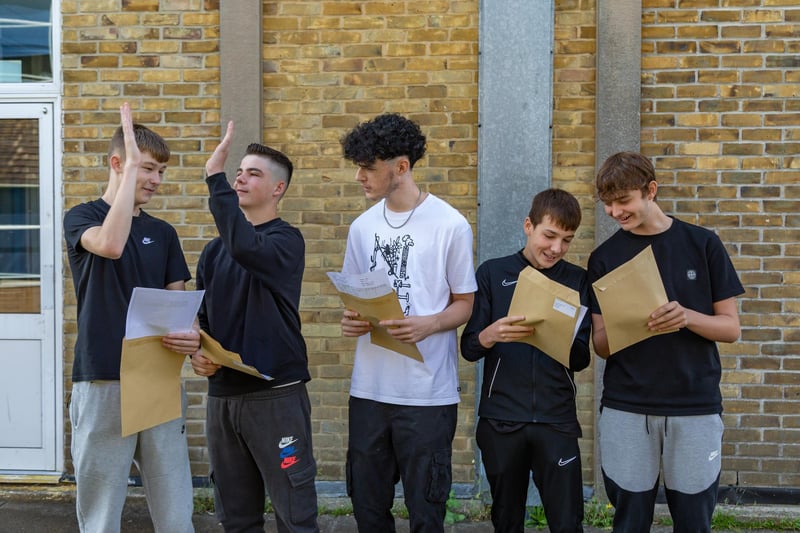 High fives between Crookhorn College students on GCSE results day. Pictured: Josh Holden, Jack Livesesy, Harvey Ross, Sam Tice and Will Carter. Picture: Mike Cooter (240823)