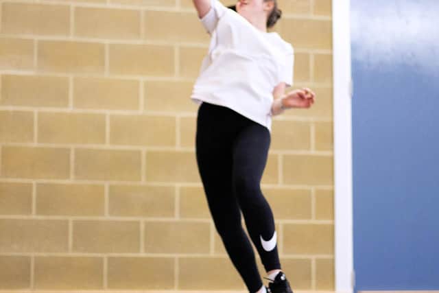 Abbie playing badminton.