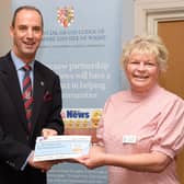 John Whitaker, head of the Hampshire & IoW Freemasons presents a cheque to the MS Therapy Centre and Jo Jennings, the centre manager. Picture: Keith Woodland (041221-38)