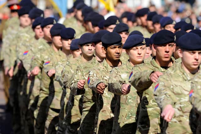 Soldiers from 12 Regiment Royal Artillery pictured parading through Emsworth for St George's Day alongside troops from 47 Regiment Royal Artillery .Picture: Allan Hutchings (131108-838)