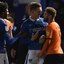 Oxford's Matty Taylor pictured grabbing Ronan Curtis by the genitals. Picture:  Mike Hewitt/Getty Images