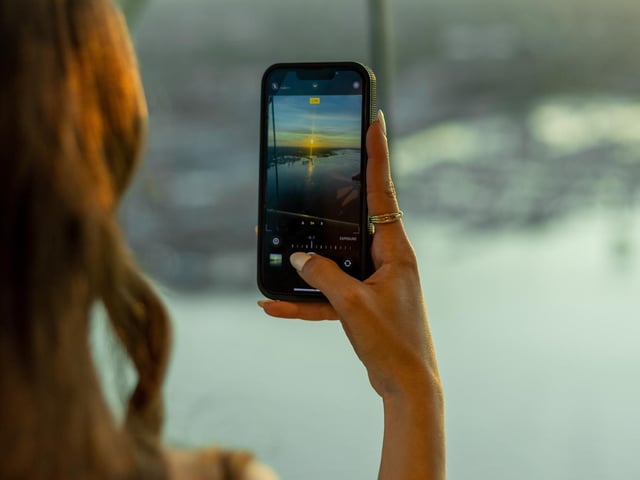 A guest capturing the view from the Sky Bar.
