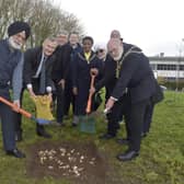 1000 spring bulbs were planted on Monday, November 28, at Nanak Woods next to Western Road, Portsmouth.Pictured is: (l-r) Tom Elliott from Colas, Dalbara Kalsi, Nigel Atkinson ESQ HM Lord-Lieutenant of Hampshire, The Very Reverend Dr Anthony Cane, Cllr. Lee Mason, Lady mayoress of Portsmouth Marie Costa, Chitranjan Chadha, Charles Haskell and the Lord mayor of Portsmouth Hugh Mason.Picture: Sarah Standing (281122-7112)