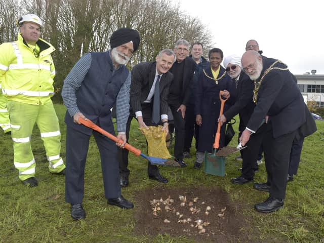 1000 spring bulbs were planted on Monday, November 28, at Nanak Woods next to Western Road, Portsmouth.

Pictured is: (l-r) Tom Elliott from Colas, Dalbara Kalsi, Nigel Atkinson ESQ HM Lord-Lieutenant of Hampshire, The Very Reverend Dr Anthony Cane, Cllr. Lee Mason, Lady mayoress of Portsmouth Marie Costa, Chitranjan Chadha, Charles Haskell and the Lord mayor of Portsmouth Hugh Mason.

Picture: Sarah Standing (281122-7112)