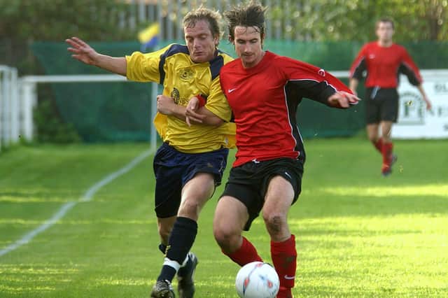 Lee Mould, left, battles for possession with Fareham's Darren Watts during a Wessex League Premier Division game in 2005. Picture: Mick Young