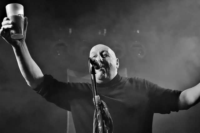 Chris Abbott in his element - introducing a band from the stage. Picture by Michele Paul Photography