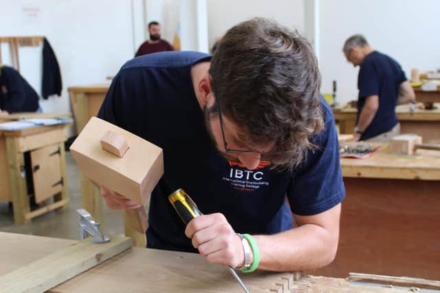 Guy chisels out a dovetail, using a beech mallet he made he made himself at IBTC Portsmouth 