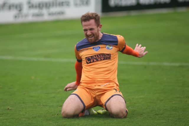 Theo Widdrington celebrates netting in the FA Cup at Bath City