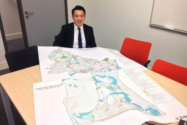 Alan Mak MP with a previous version of Havant Borough Council's Local Plan