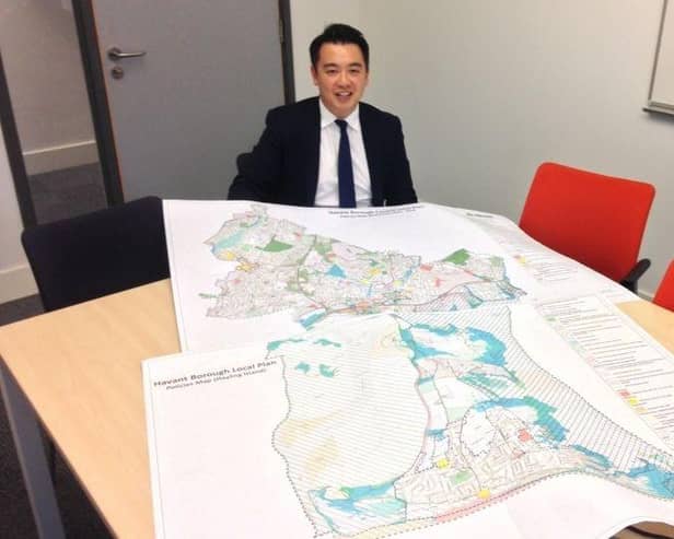 Alan Mak MP with a previous version of Havant Borough Council's Local Plan