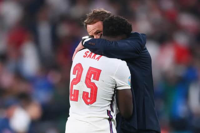 Bukayo Saka of England is consoled by Gareth Southgate, Head Coach of England following defeat in the UEFA Euro 2020 Championship Final between Italy and England at Wembley Stadium. Picture: Laurence Griffiths/Getty Images