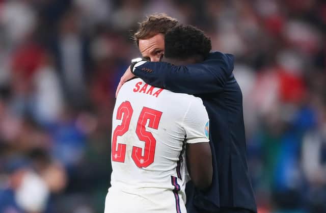 Bukayo Saka of England is consoled by Gareth Southgate, Head Coach of England following defeat in the UEFA Euro 2020 Championship Final between Italy and England at Wembley Stadium. Picture: Laurence Griffiths/Getty Images
