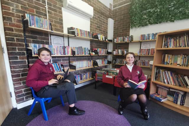 Rowner Junior School pupils, Havery Jenkins and Maisy Kendell, both 11, enjoying reading in the school's library.