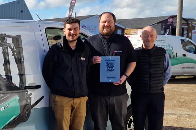 From left - Matthew Morrell, Ryan Davis and Paul Schock with the Dealer of the Year Award