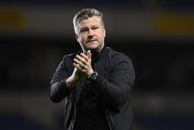 Oxford United boss Karl Robinson has been installed as the bookies' favourite to land the QPR role.