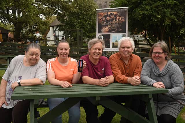 Pictured: Sergeant Sidney Cornell's medal found in Thames is reunited with family members. Penny Cornell with the medal. Left/Right: All Cornells, Mags (Kevin's wife), Penny, Chris, Kevin (also Great Nephew like Chris) and Chris' wife Dawn.
Photo: Simon Czapp/Solent News