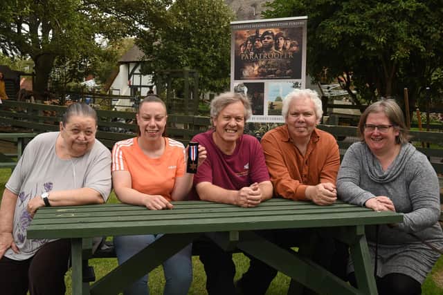 Pictured: Sergeant Sidney Cornell's medal found in Thames is reunited with family members.  Penny Cornell with the medal.  Left/Right:  All Cornells, Mags (Kevin's wife), Penny, Chris, Kevin (also Great Nephew like Chris) and Chris' wife Dawn.
Photo:  Simon Czapp/Solent News