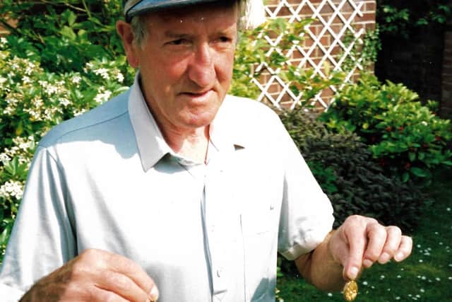 Peter Harris, pictured in 2003, with the two medals the Pompey History Society is fundraising for.
